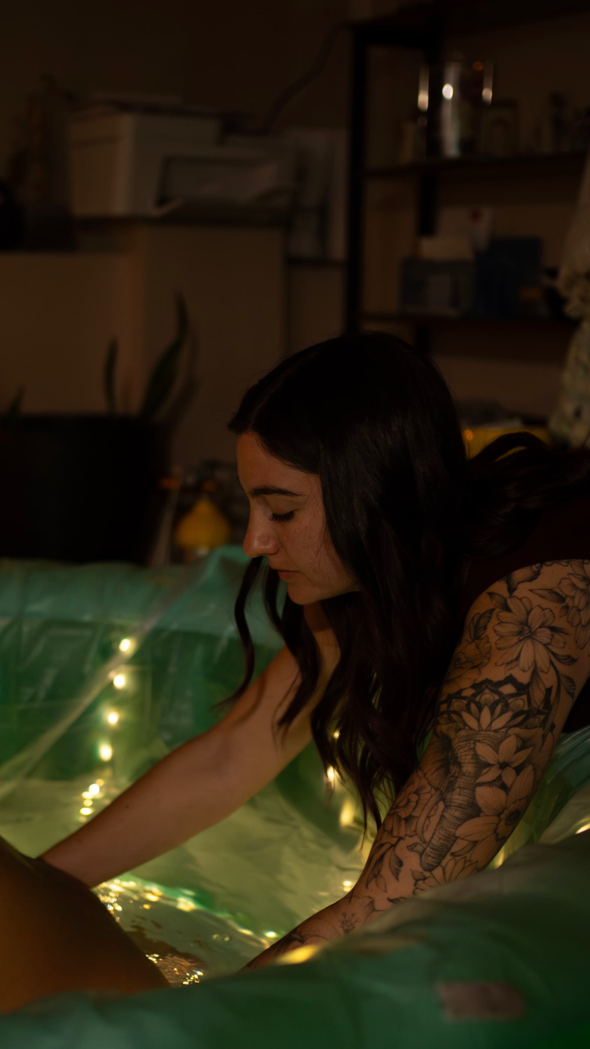 Serene water birth with ambient lighting